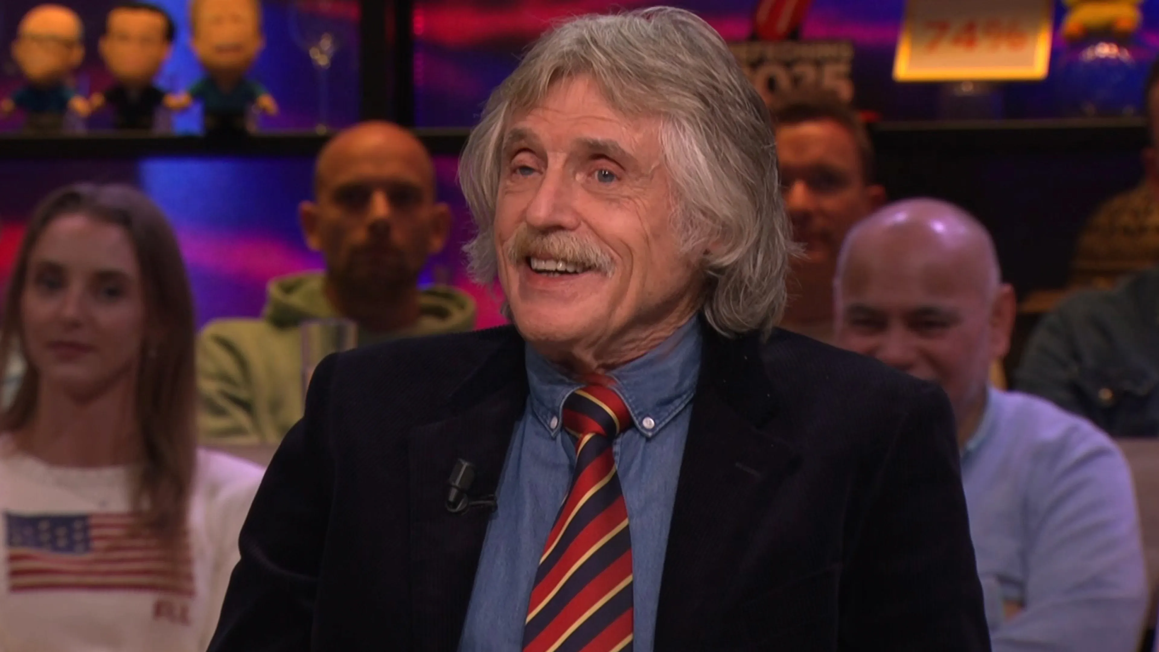 Dit peperdure prijskaartje hangt aan de stropdassen van Johan Derksen